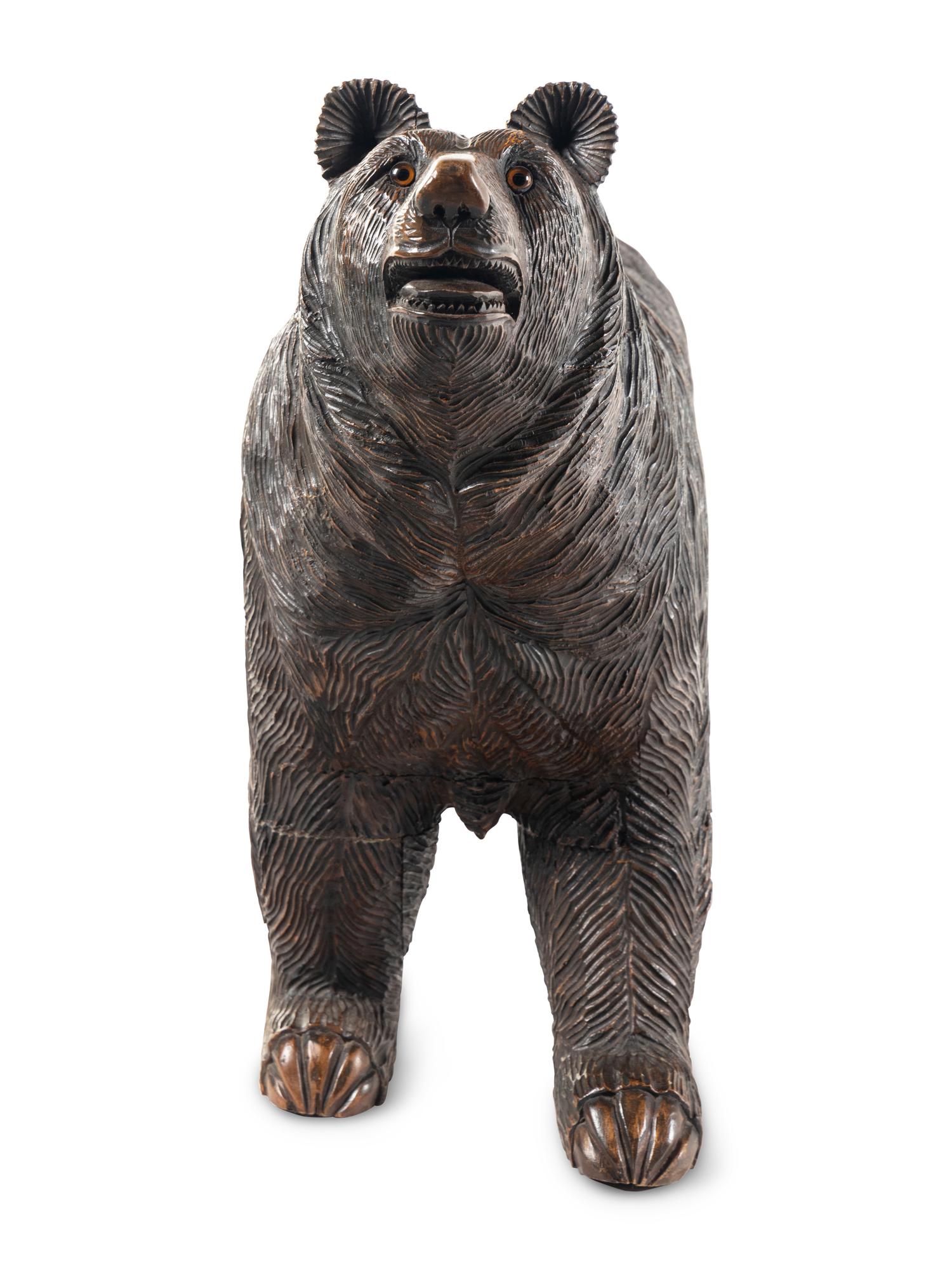 A Swiss Black Forest Carved Walnut Bear