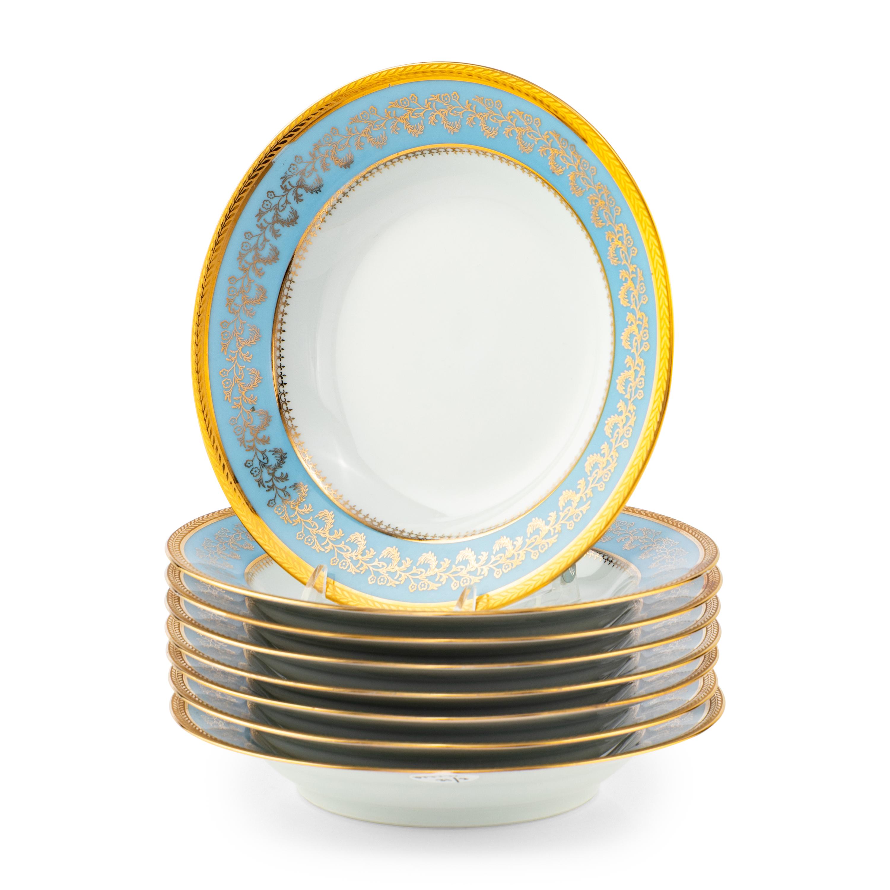 A Set of Eight Limoges Porcelain Soup Plates