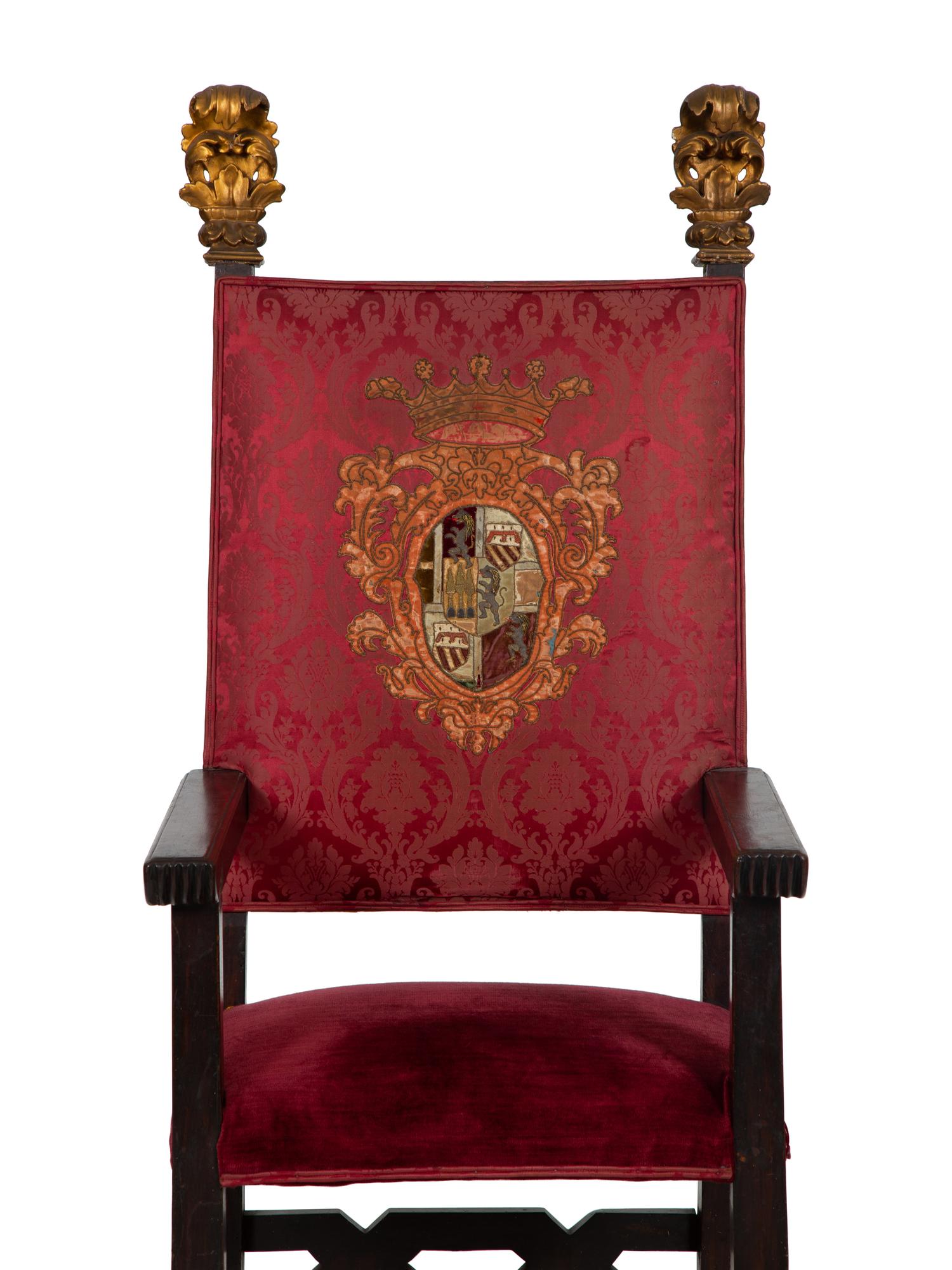 An Italian Baroque Style High Back Arm Chai r