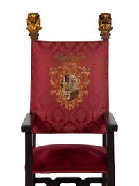 An Italian Baroque Style High Back Arm Chai r