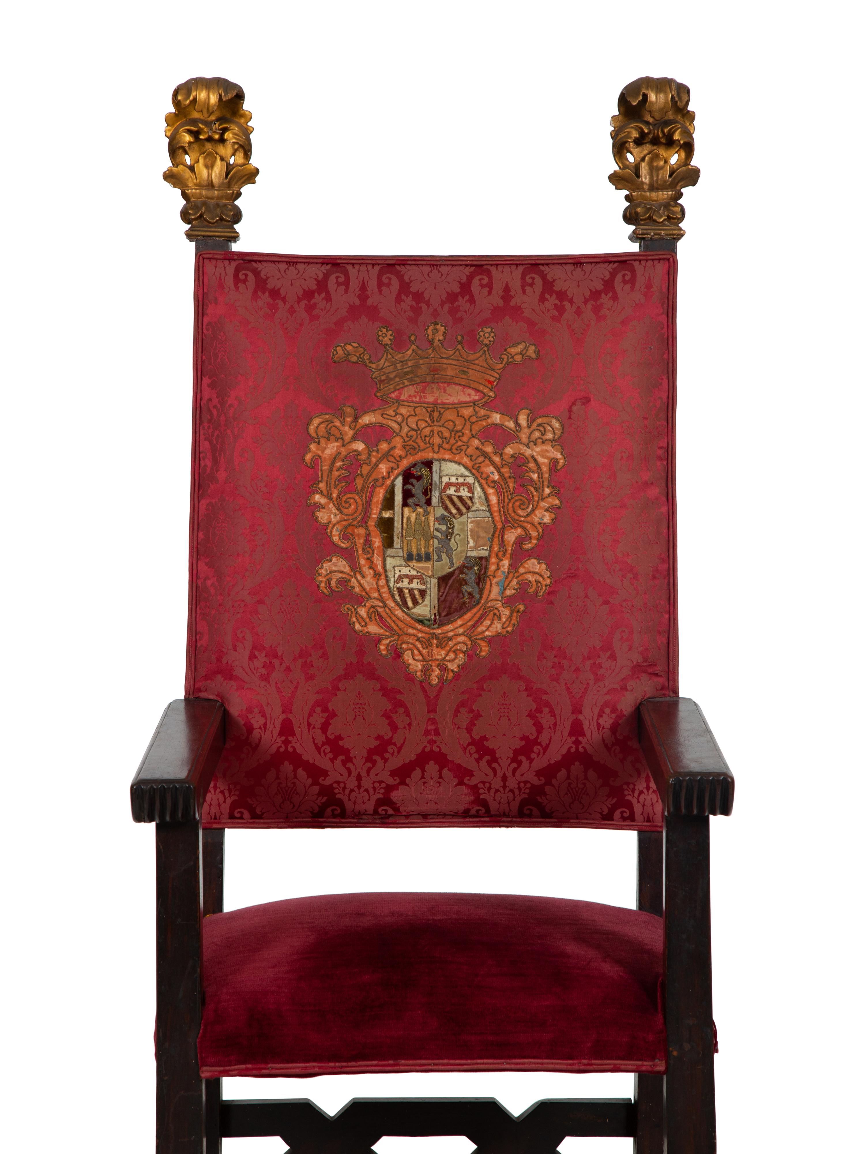 An Italian Baroque Style High Back Arm Chai r
