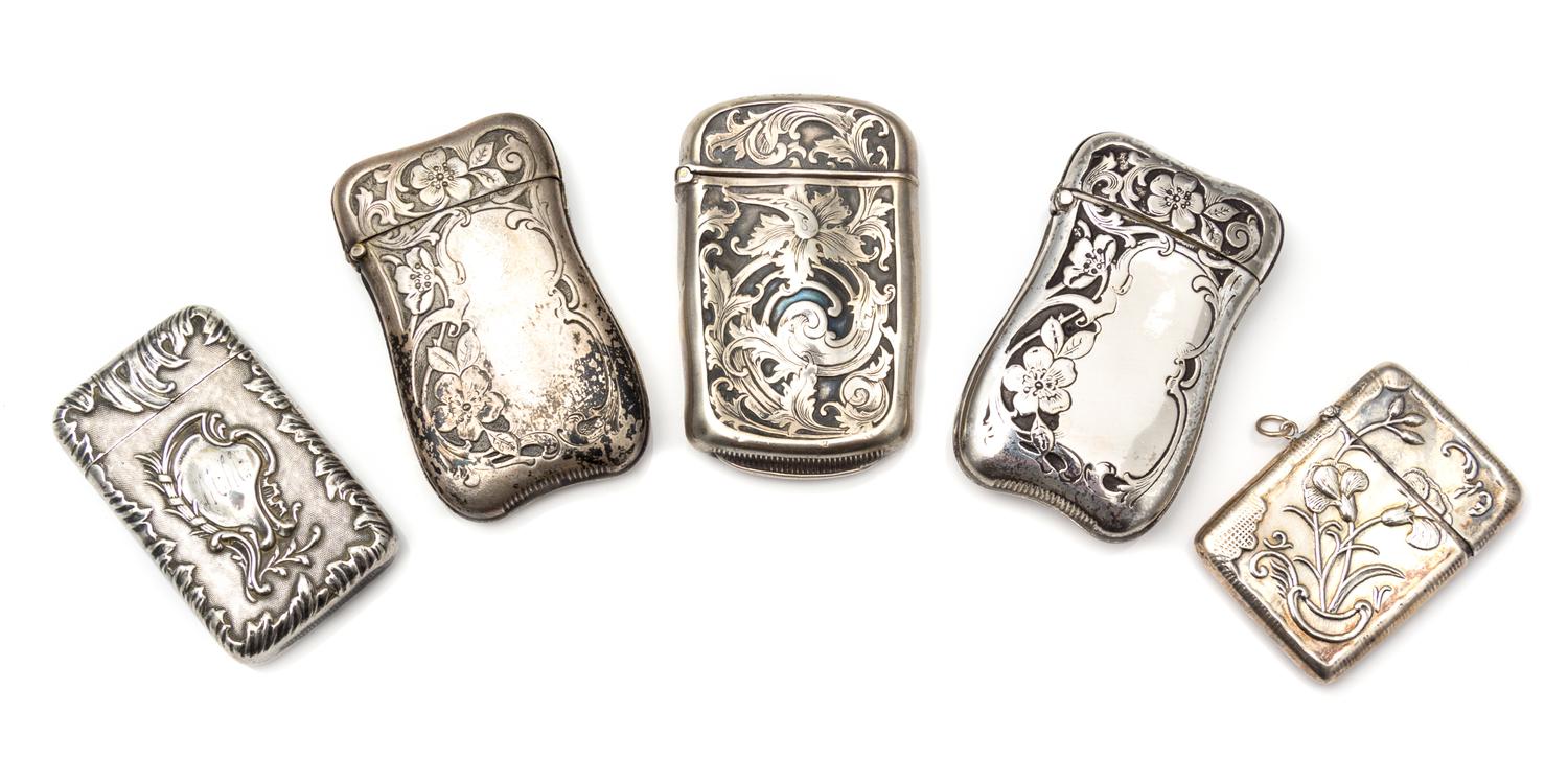 Two American Silver Vesta Cases, Various Makers, comprising an example with Art Nouveau style floral and foliate decoration and a small