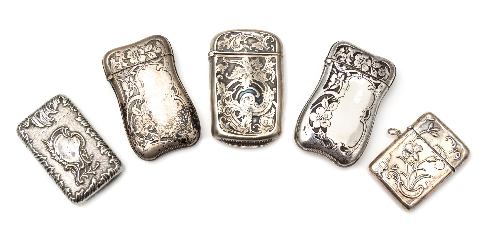 Two American Silver Vesta Cases, Various Makers, comprising an example with Art Nouveau style floral and foliate decoration and a small