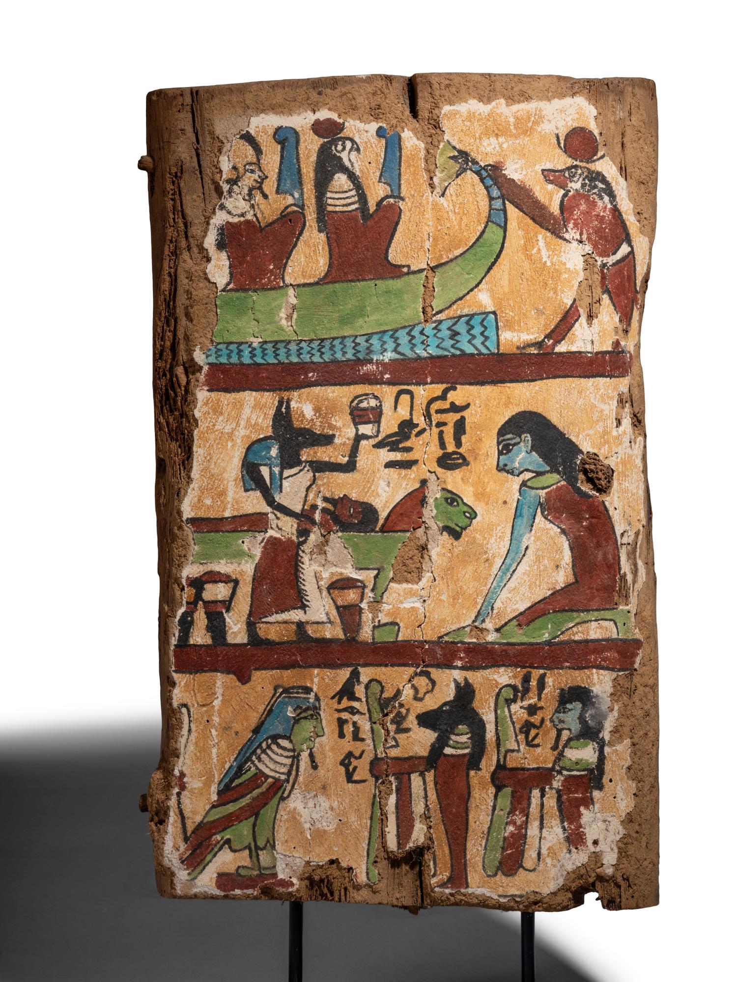 An Egyptian Painted Wood Sarcophagus Fragment with a Boat Scene