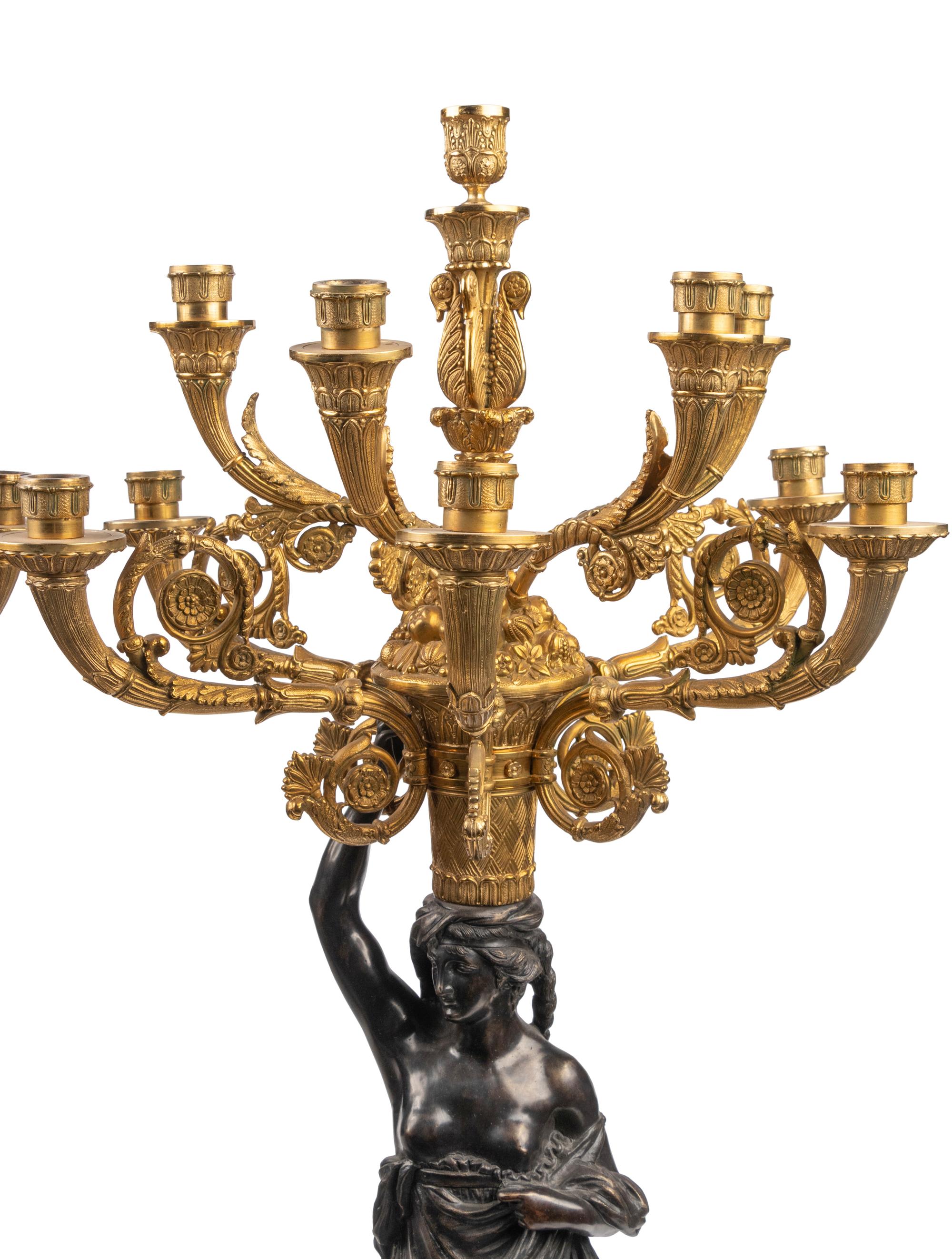 A Large French Gilt and Patinated Bronze and Rouge Marble Three-Piece Clock Garniture