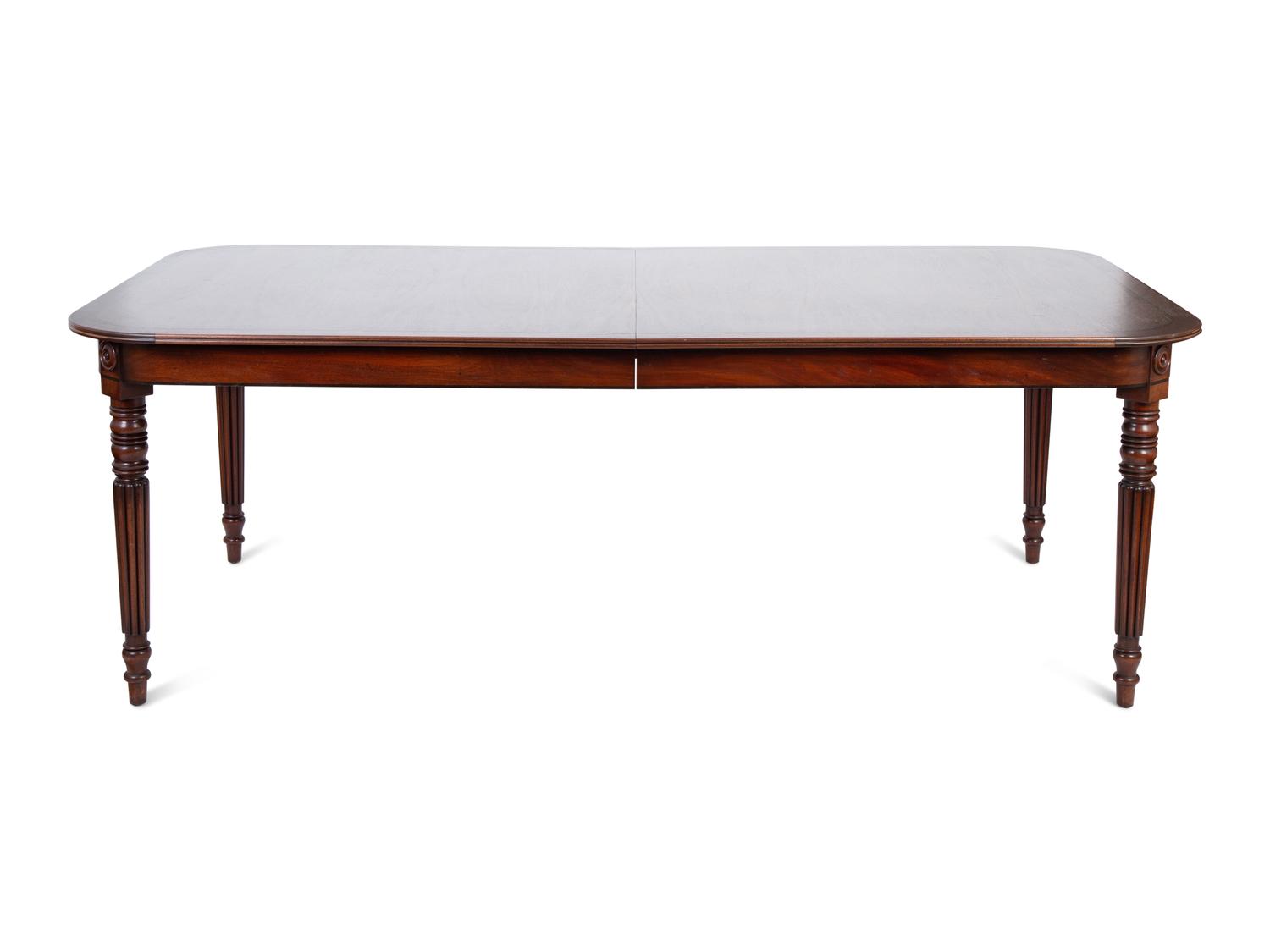 A Regency Style Inlaid Mahogany Dining Table