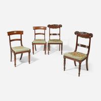 A group of four Regency carved mahogany side chairs circa 1810-1820