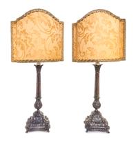 A Pair of Italian Silver Candlesticks, Nardi, Venice, mounted as lamps with silk shades.