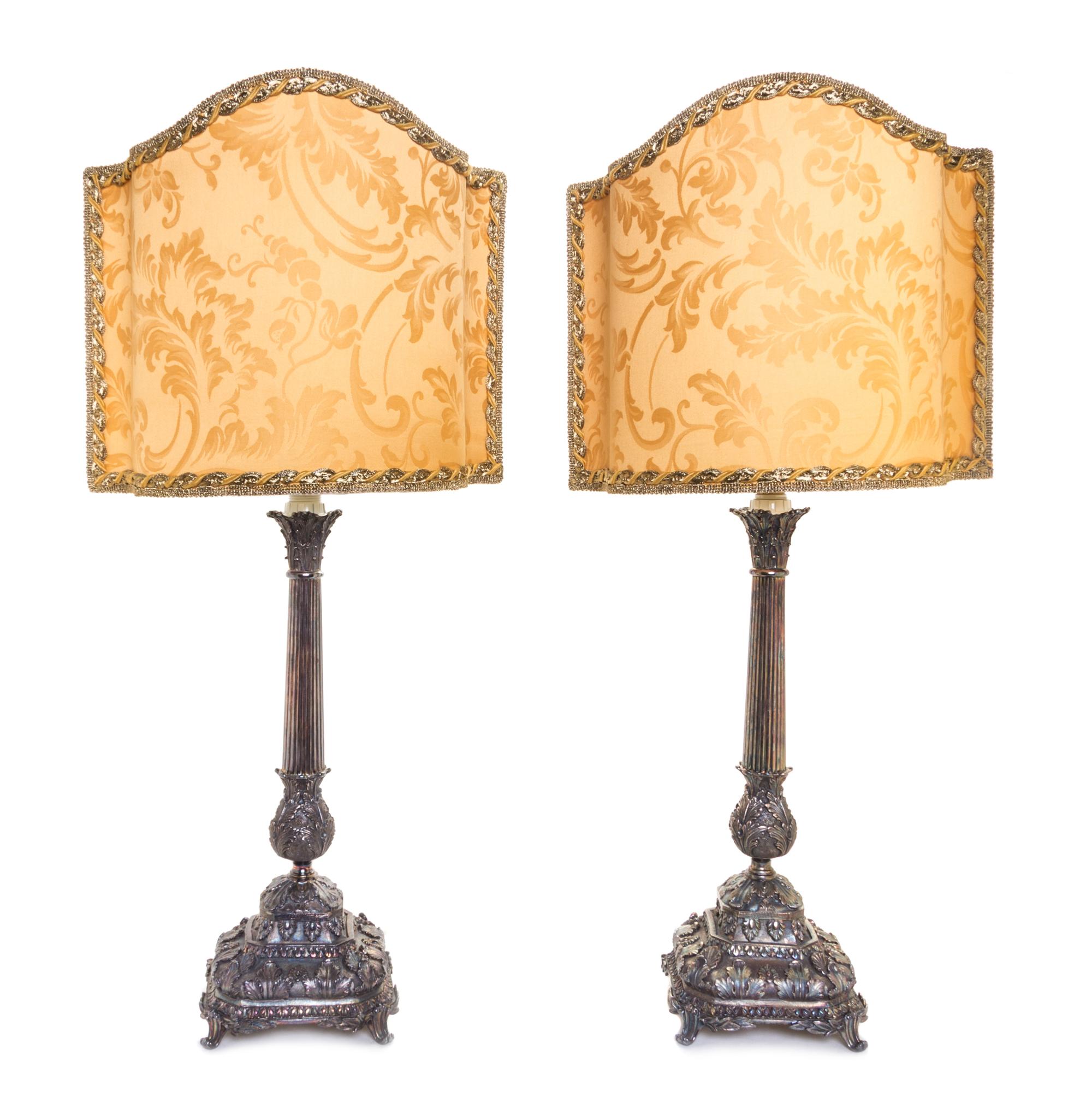 A Pair of Italian Silver Candlesticks, Nardi, Venice, mounted as lamps with silk shades.