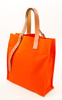An Hermès Orange Canvas Etiviere Shopping Tote, 16" x 17" x 6"; Strap adjustable to 17".