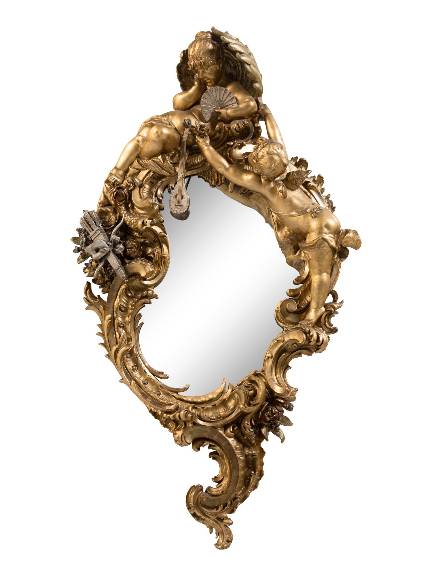 A Baroque Style Gilt and Silvered Composition Mirror