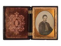 [CIVIL WAR]. Quarter plate ambrotype of seated Zouave.