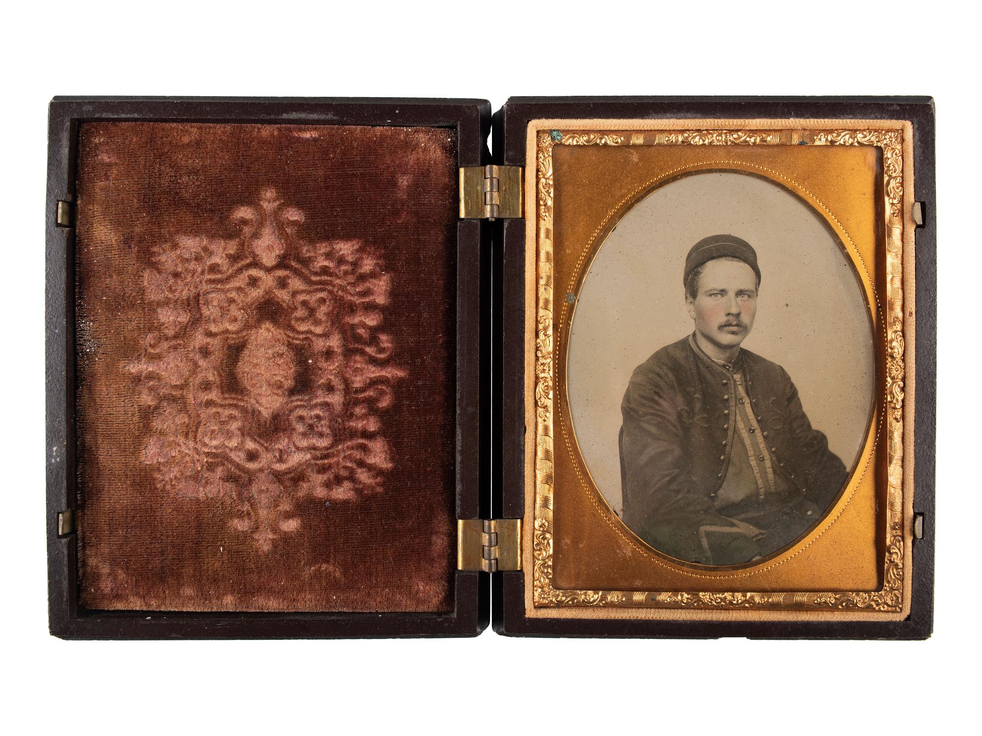 [CIVIL WAR]. Quarter plate ambrotype of seated Zouave.