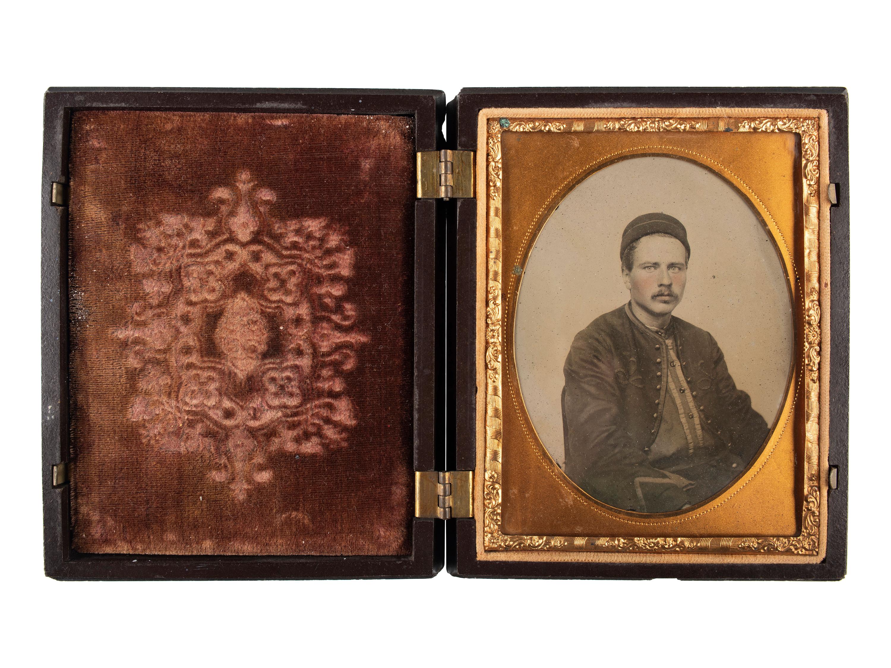 [CIVIL WAR]. Quarter plate ambrotype of seated Zouave.