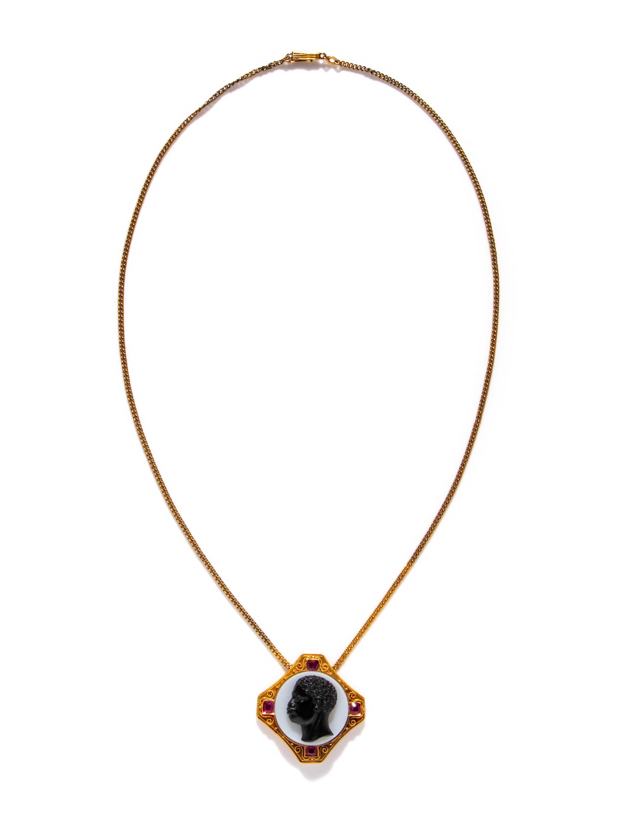 A Neoclassical Gold, Rubie, and Onyx Cameo Pendant with the Portrait Head of a Moore — with a gold chain