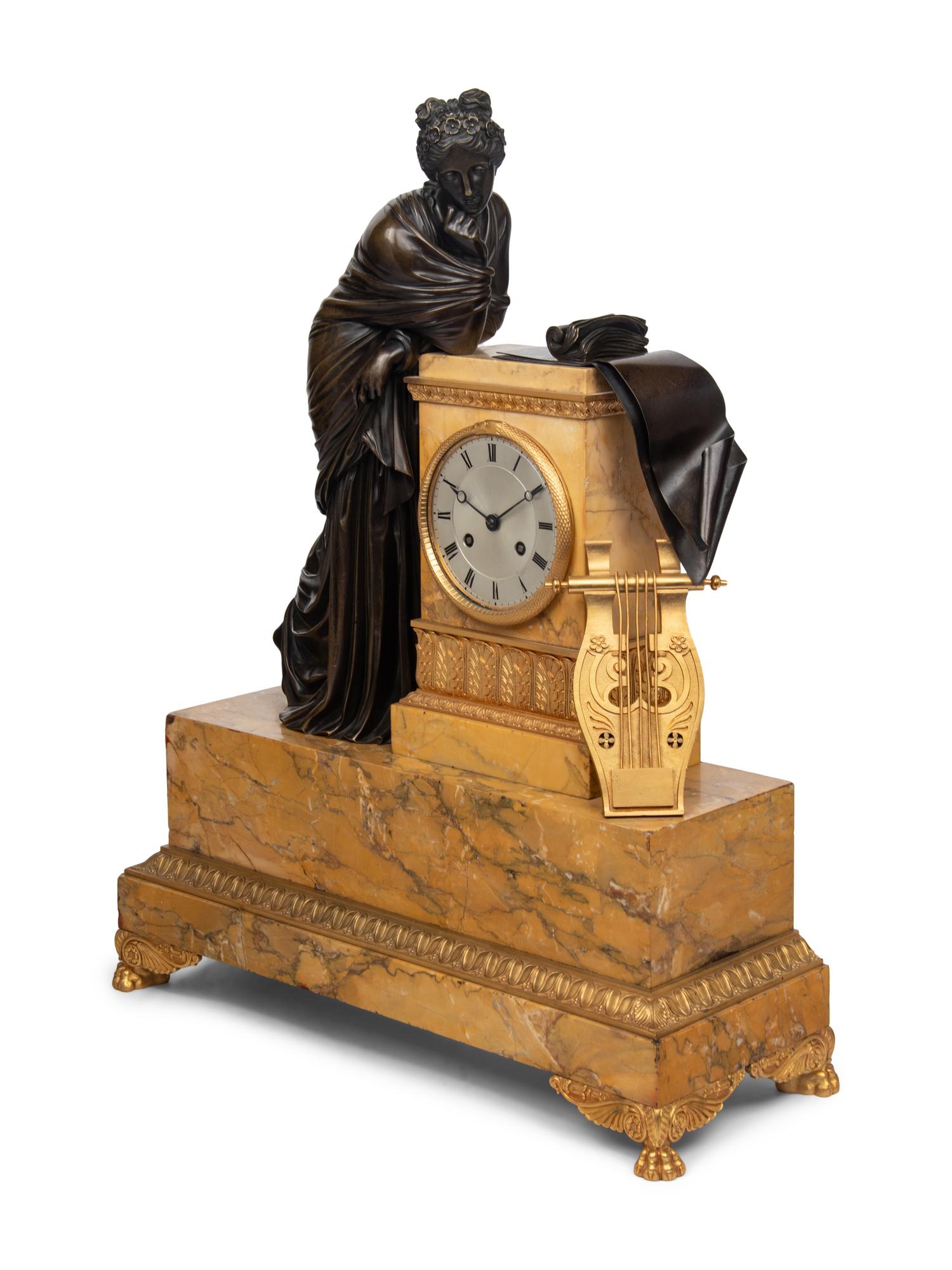 A Large Empire Gilt and Patinated Bronze and Marble Figural Clock