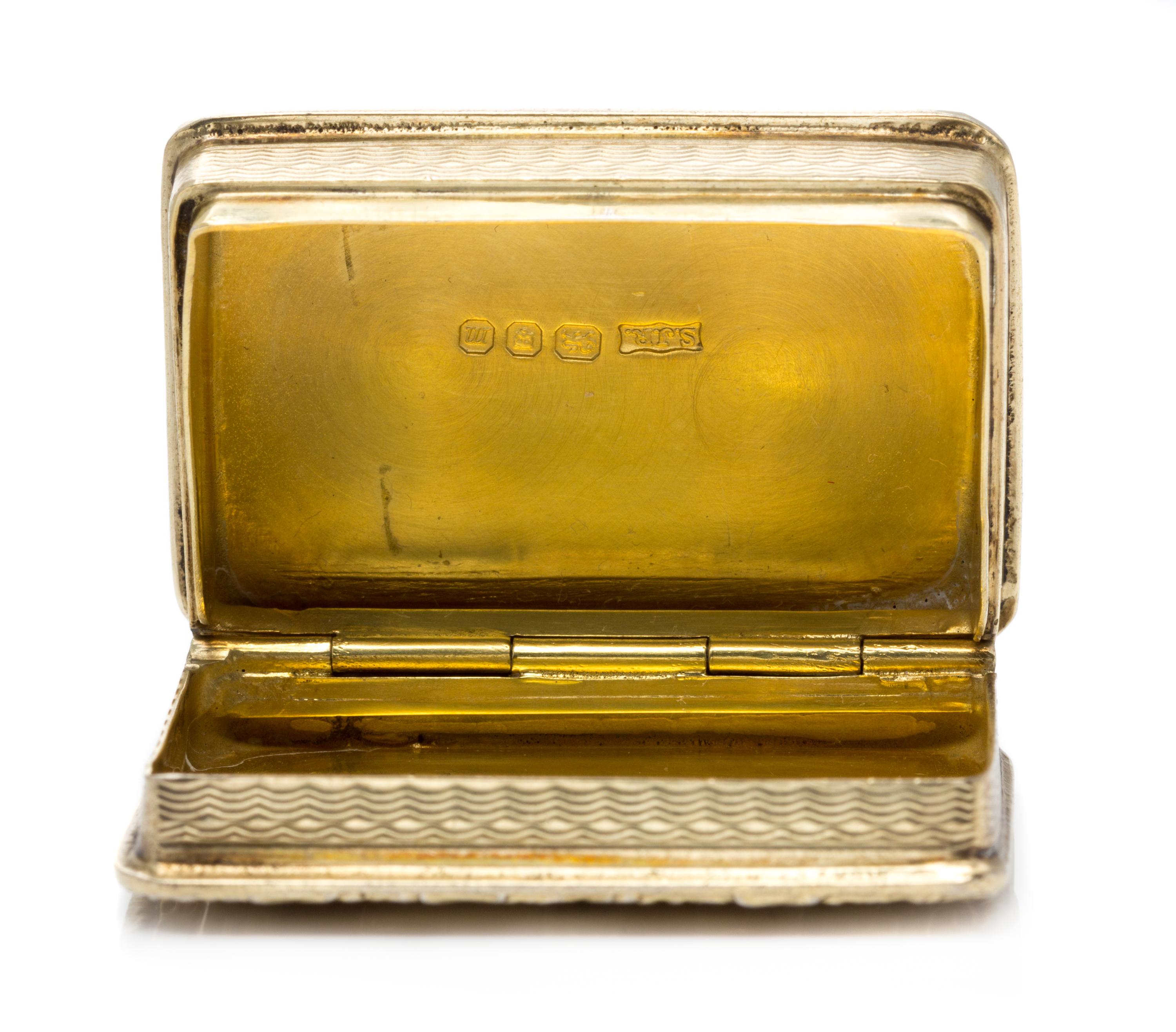 An English Silver-Gilt Pill Box, S. J. Rose & Son, London, 1967, the lid worked to depict Hampton Court.