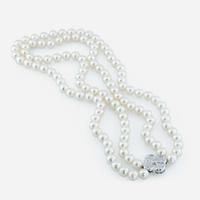 An 18K white gold, cultured pearl and diamond necklace, Mikimoto
