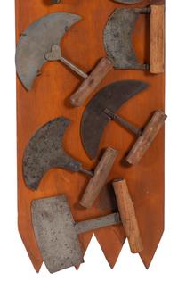 A Collection of Wrought Iron Kitchen Tools Mounted to Panel