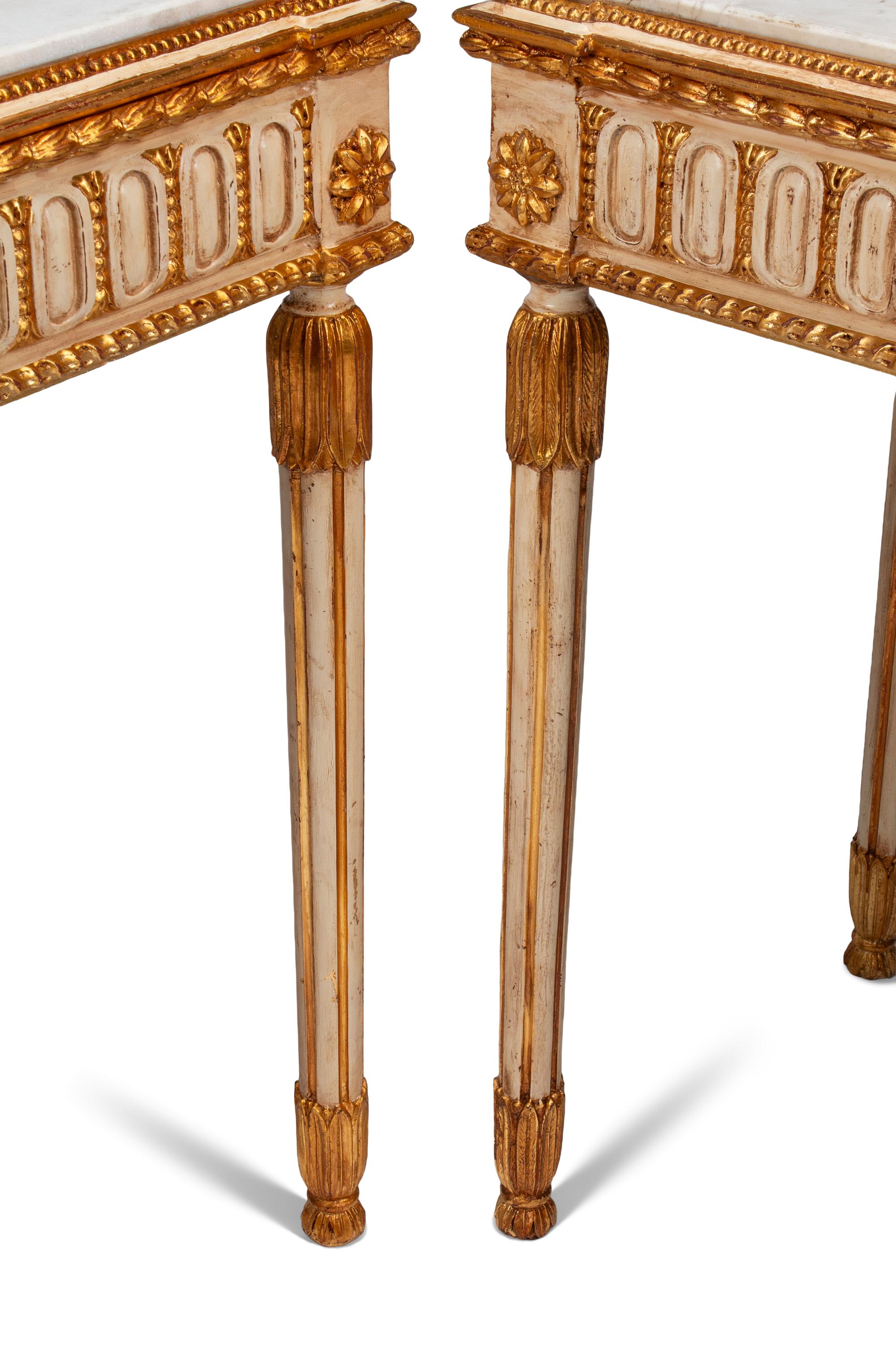 A Pair of Italian Neoclassical Style Cream-Painted, Parcel Gilt and Micro Mosaic Plaque-Mounted Console Tables