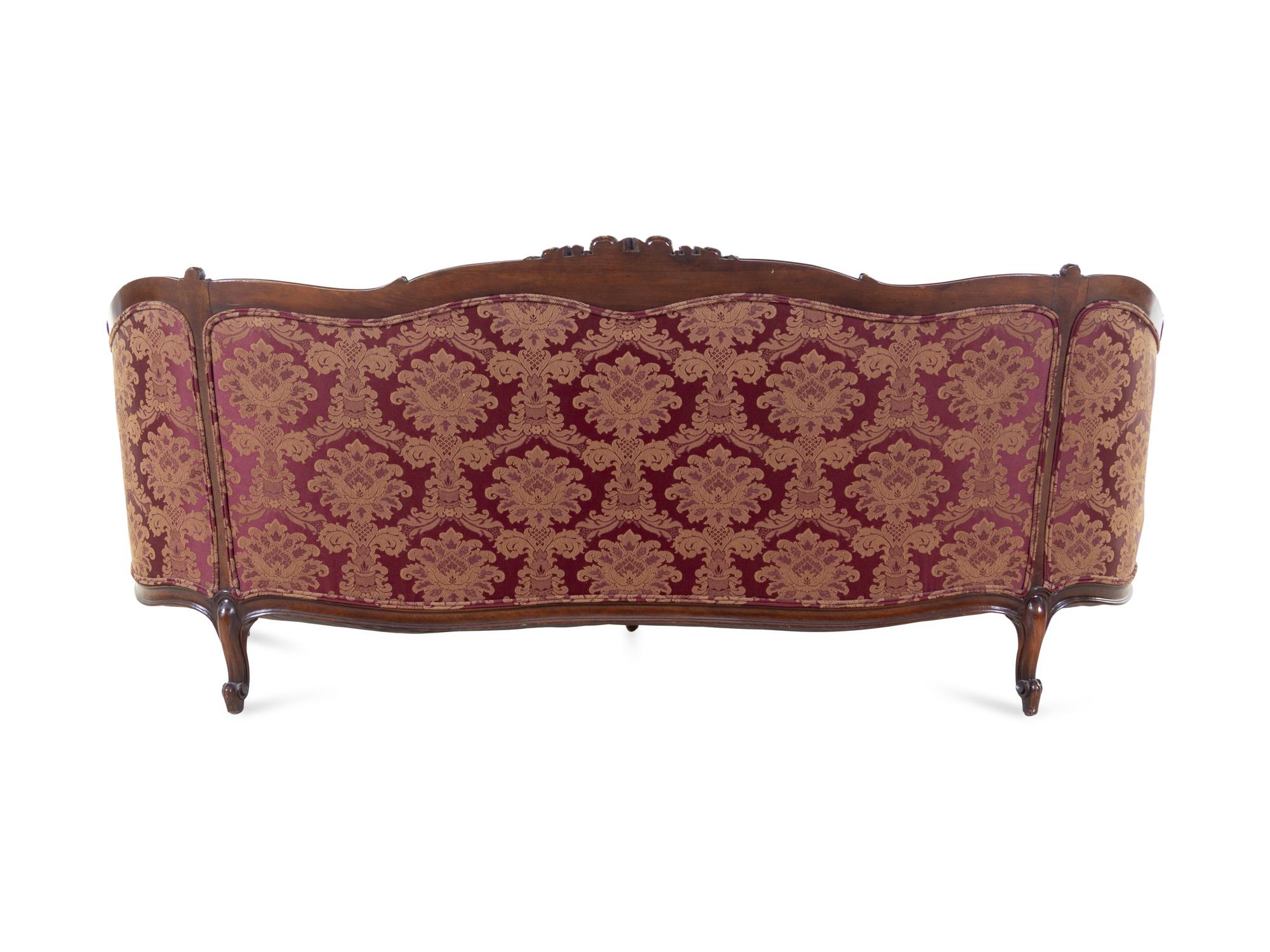 A Rococo Revival Carved Walnut Sofa