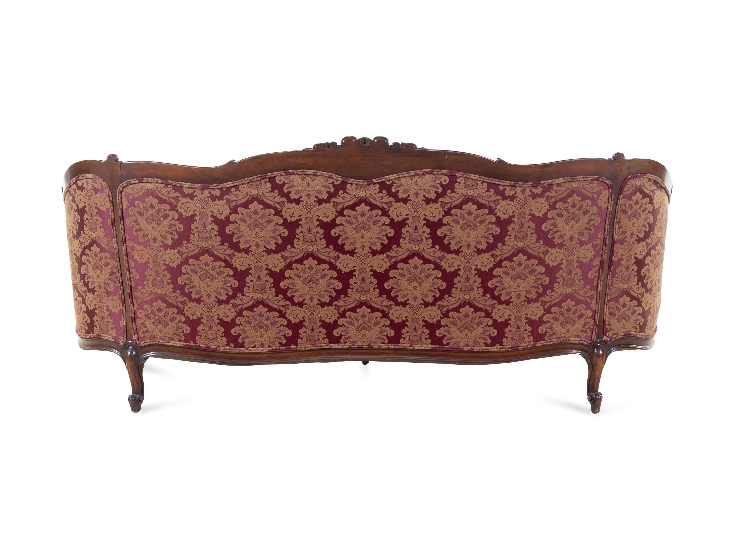 A Rococo Revival Carved Walnut Sofa