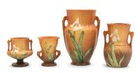 Four Roseville Iris Pottery Vases Height of tallest 8 1/2 inches.