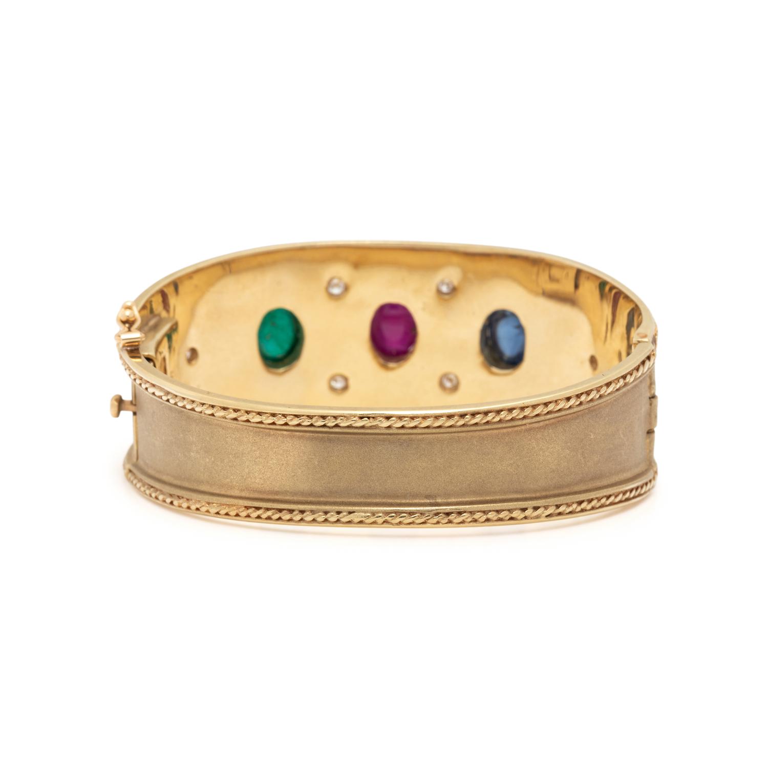 BRUSHED YELLOW GOLD, RUBY, EMERALD, SAPPHIRE, AND DIAMOND BANGLE BRACELET