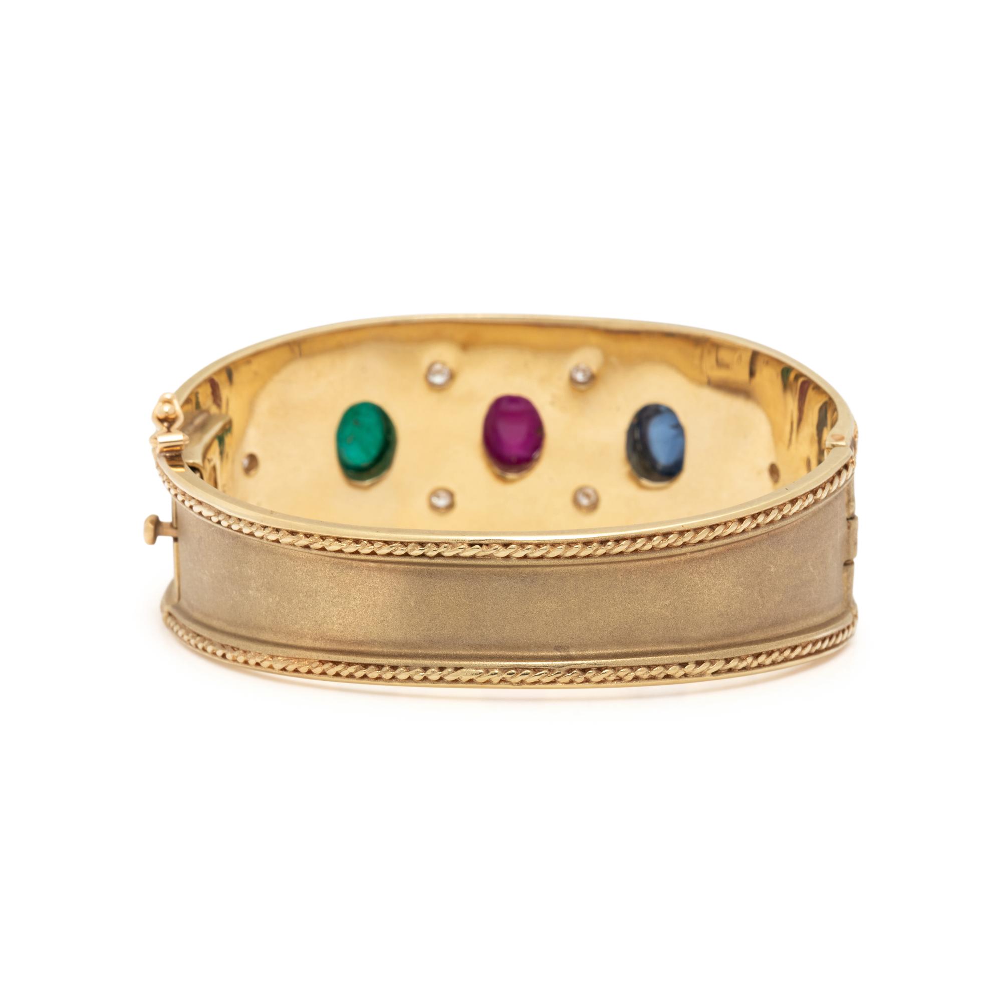 BRUSHED YELLOW GOLD, RUBY, EMERALD, SAPPHIRE, AND DIAMOND BANGLE BRACELET