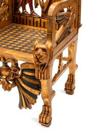 A Pair of Egyptianesque Painted and Giltwood Throne Chairs