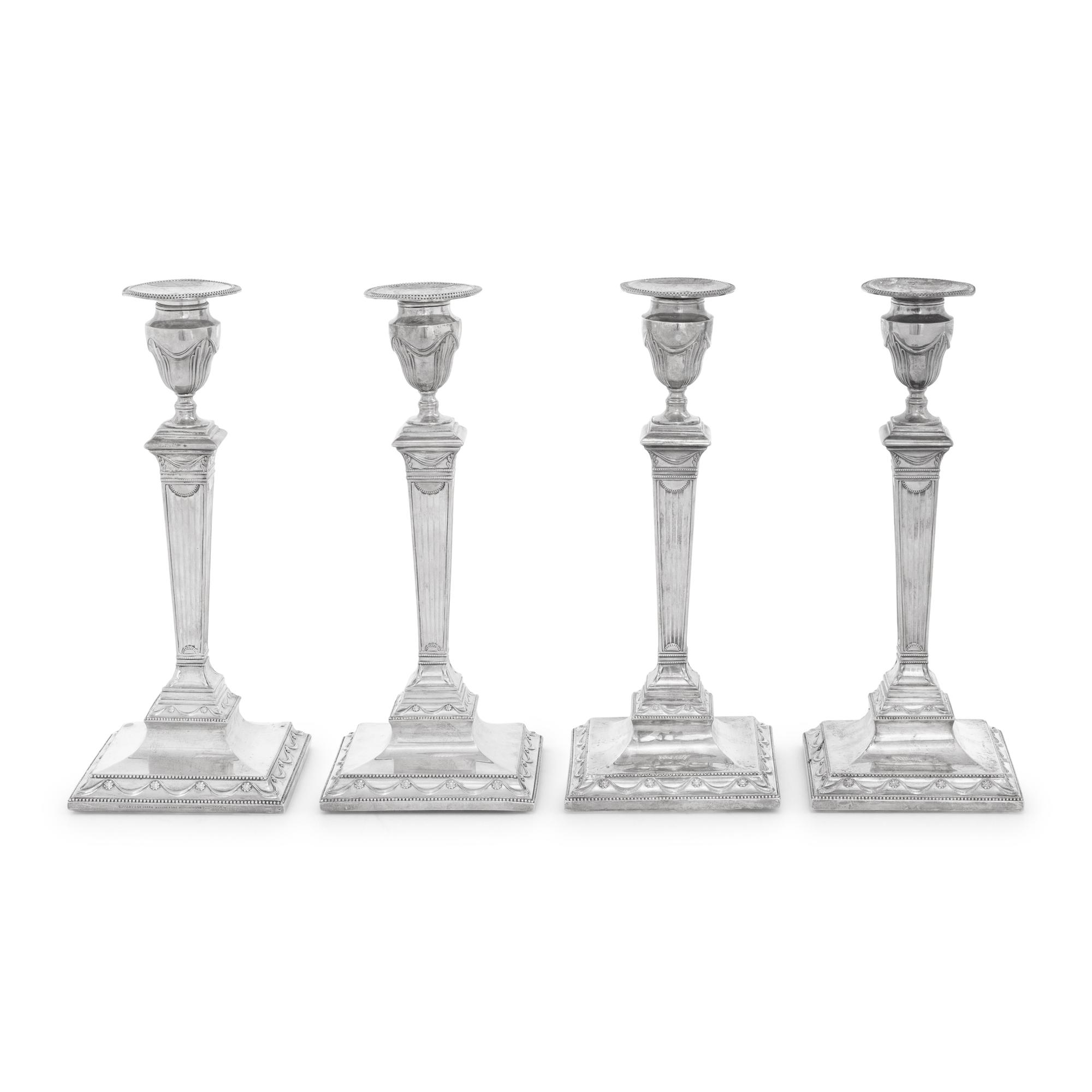A Set of Four Neoclassical Silver Candlesticks