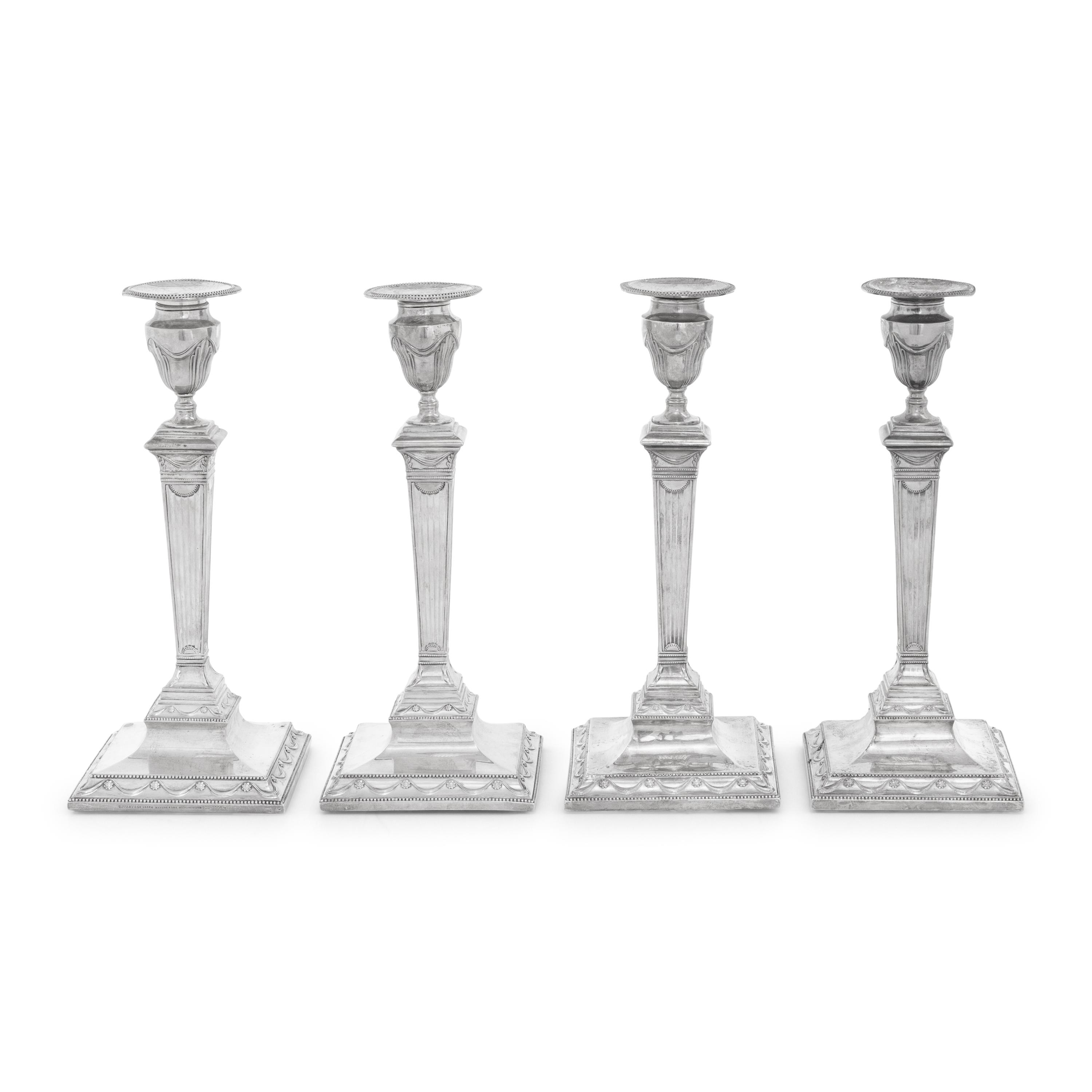 A Set of Four Neoclassical Silver Candlesticks