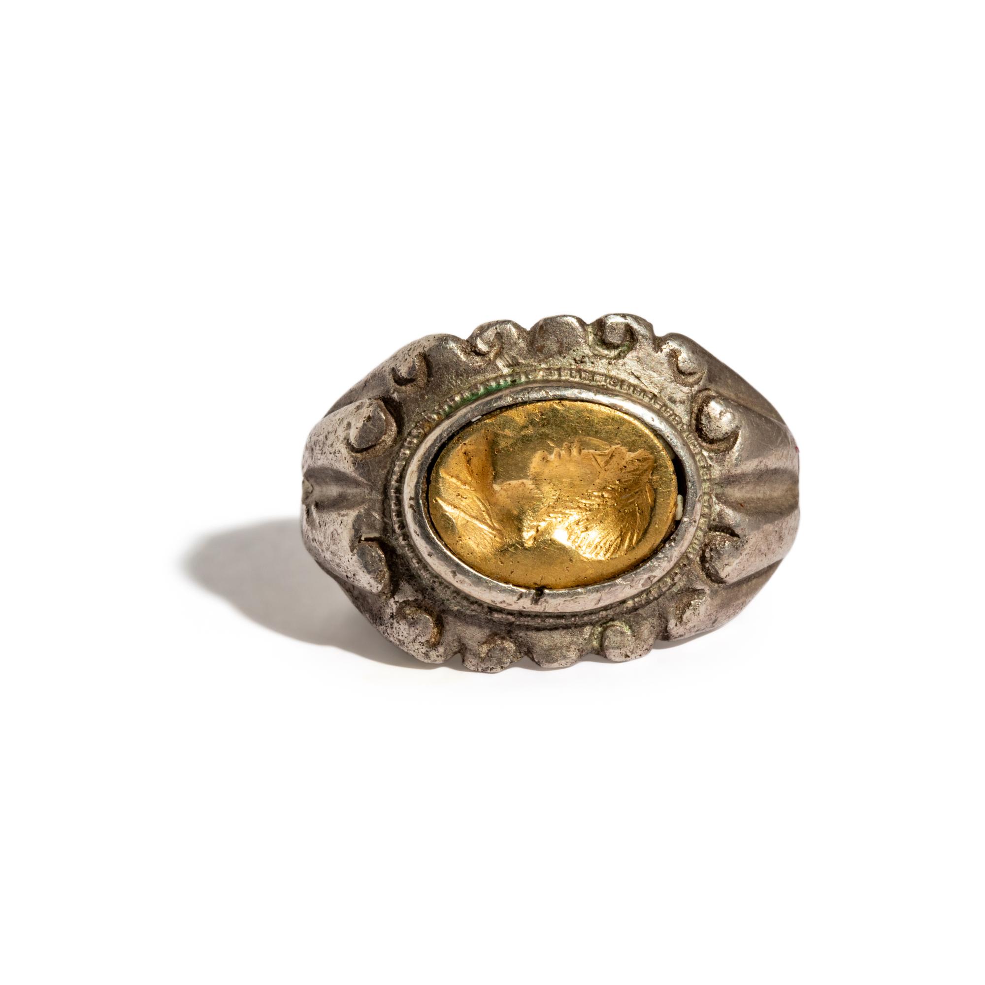 A Roman Silver and Gold Finger Ring with a Portrait Head