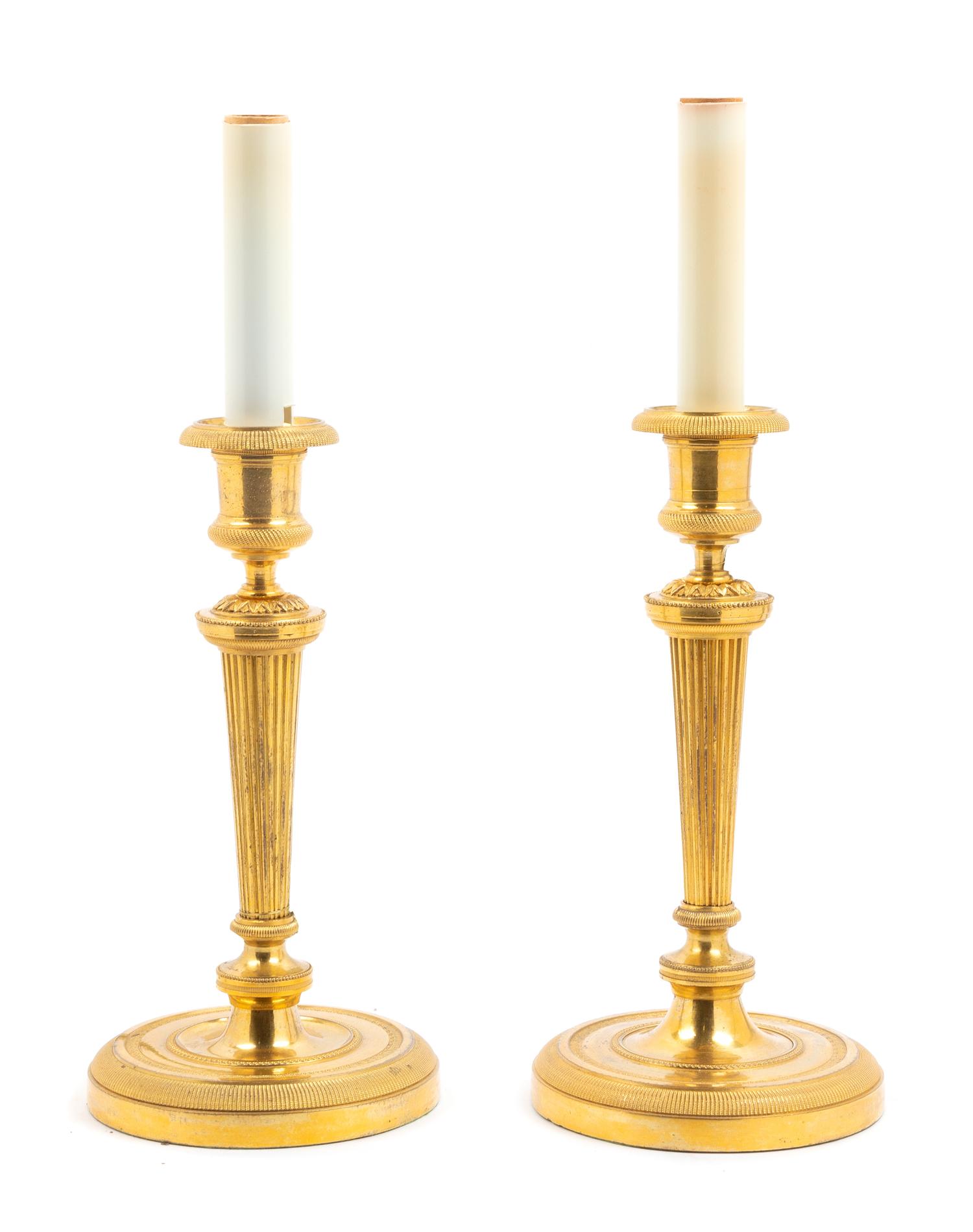 A Pair of Neoclassical Gilt Bronze Candlesticks