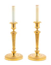 A Pair of Neoclassical Gilt Bronze Candlesticks