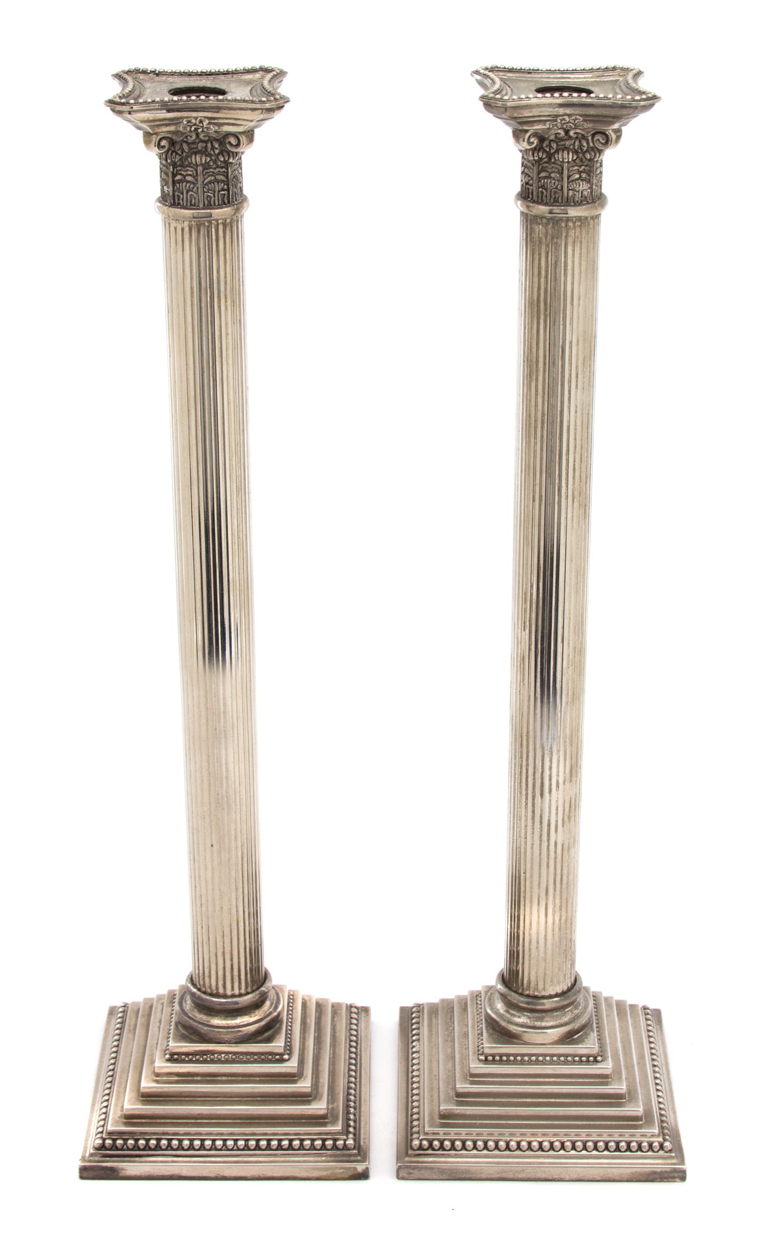 A Pair of Silver Plate Tall Columnar Candlesticks — 20TH CENTURY