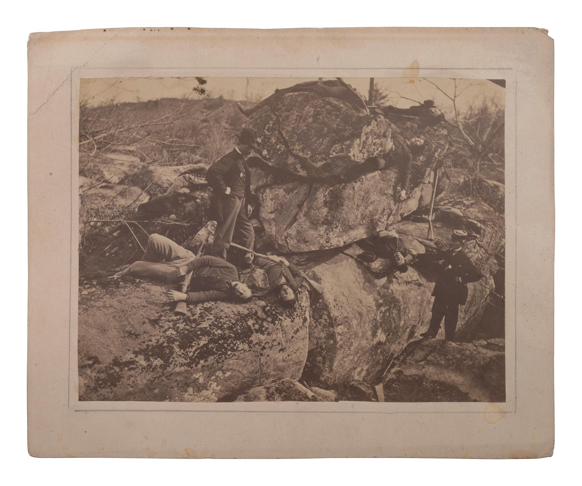[CIVIL WAR]. A group of 3 albumen photographs, highlighted by views of possible casualties near Devil's Den, Gettysburg.