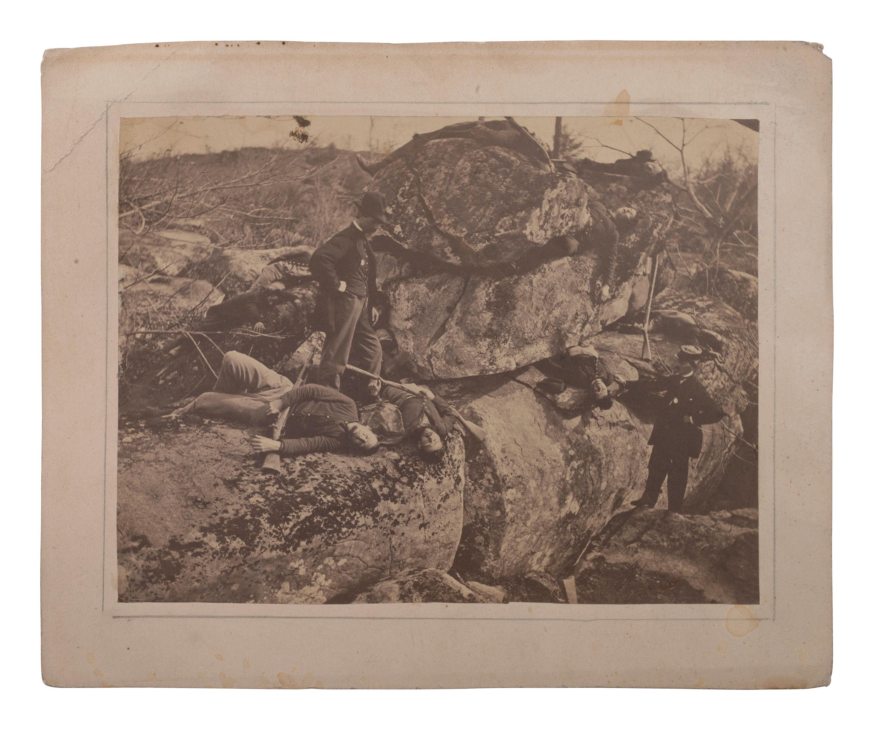 [CIVIL WAR]. A group of 3 albumen photographs, highlighted by views of possible casualties near Devil's Den, Gettysburg.