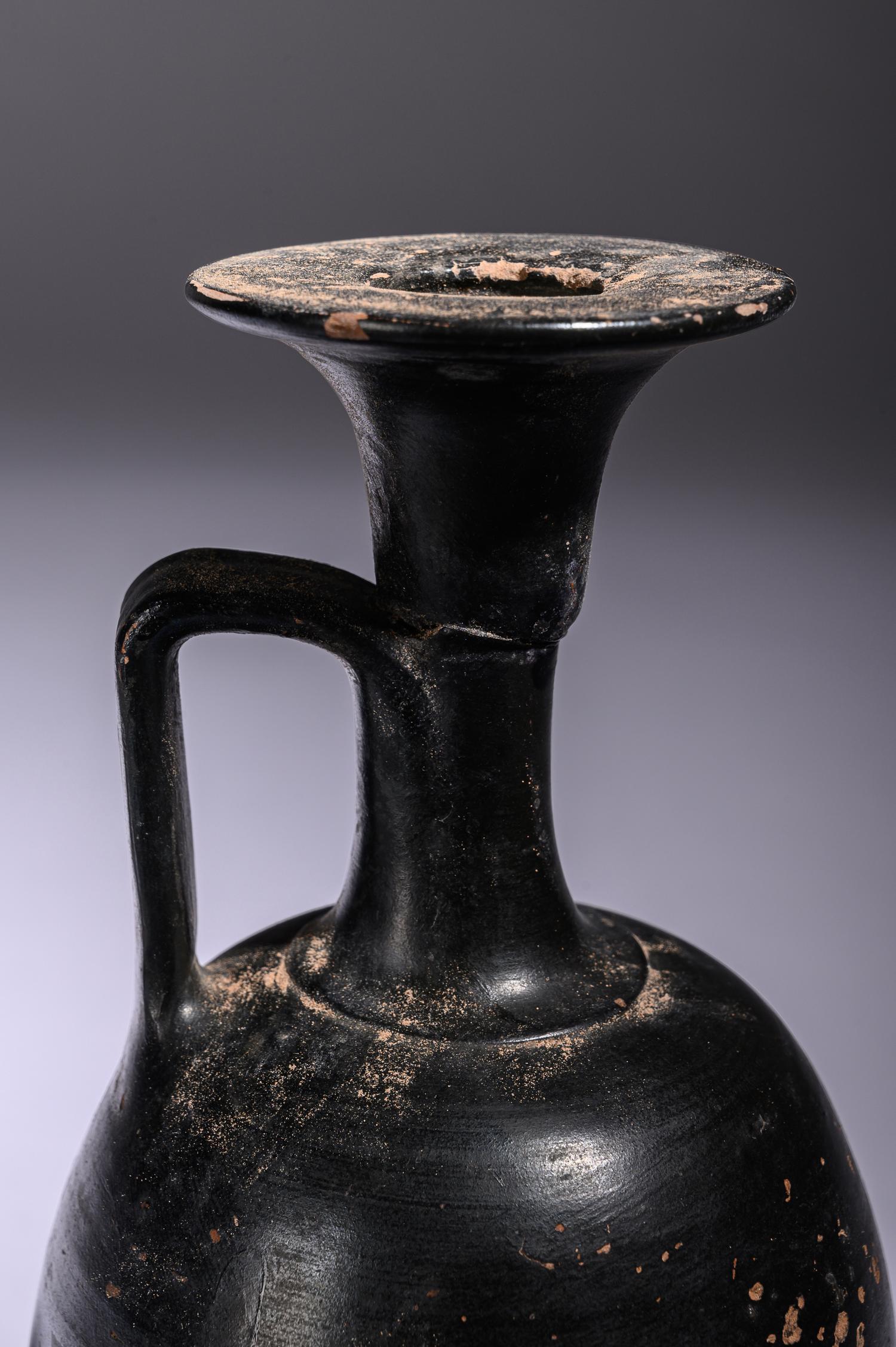 A Greek Black Glazed Lekythos