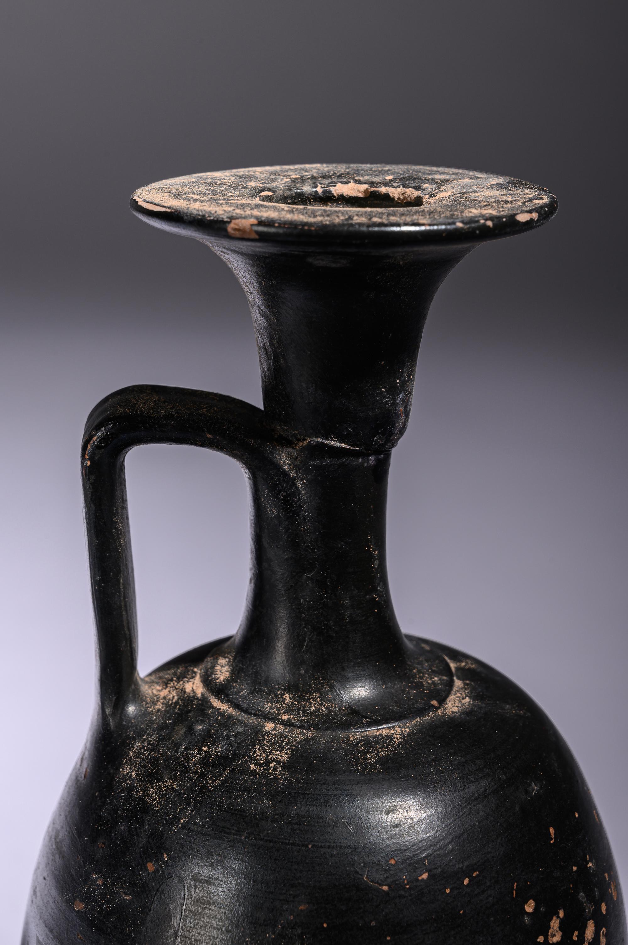 A Greek Black Glazed Lekythos