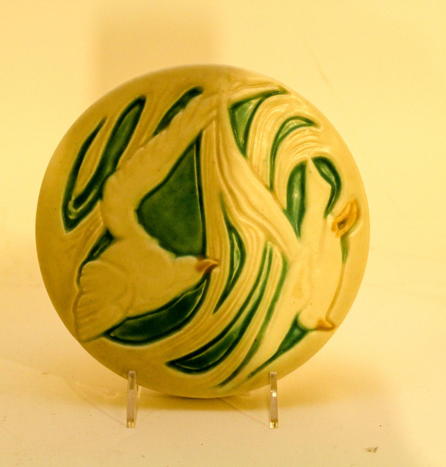 A Porcelain Trivet. Diameter 6 1/4 inches.