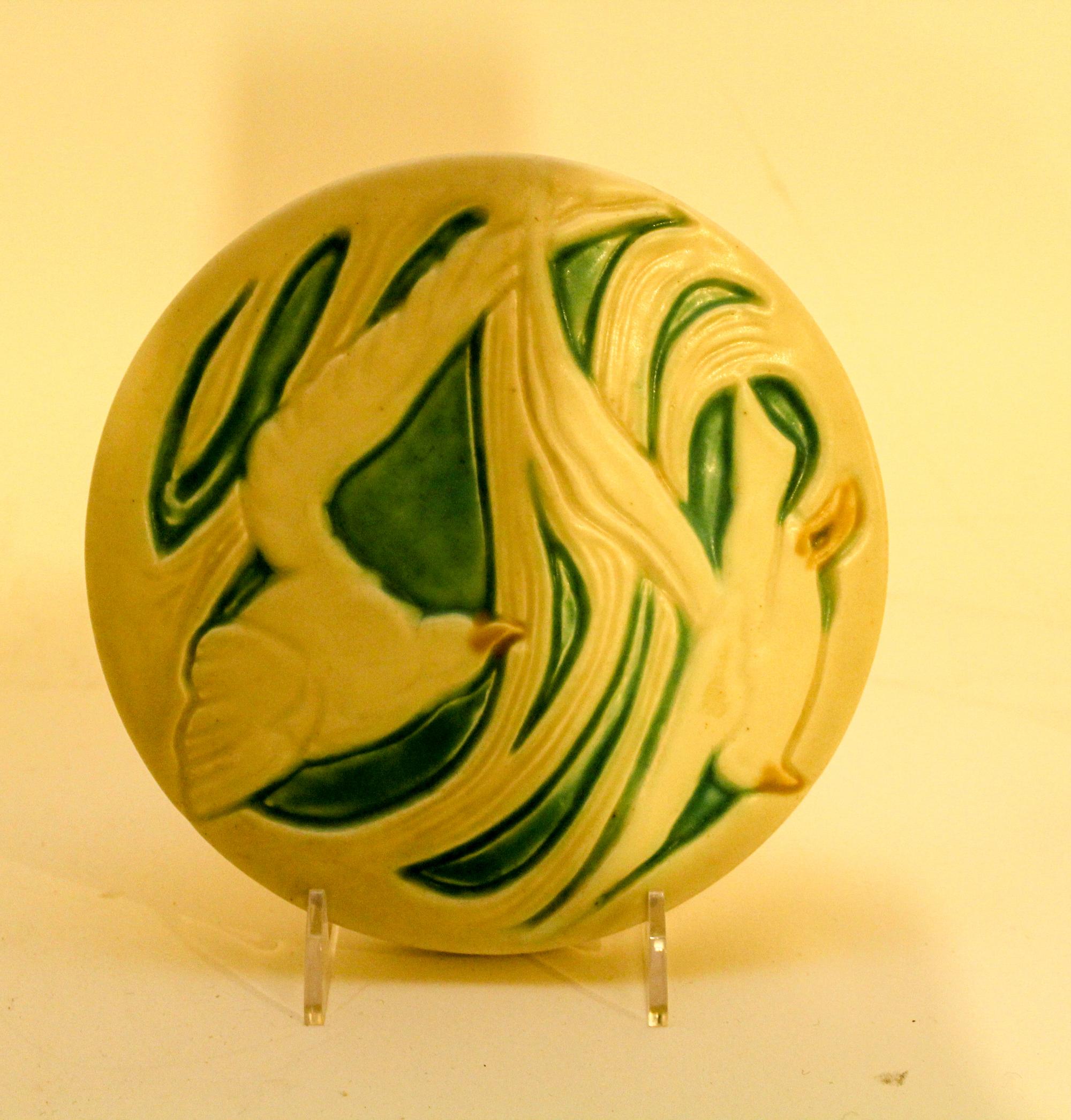 A Porcelain Trivet. Diameter 6 1/4 inches.