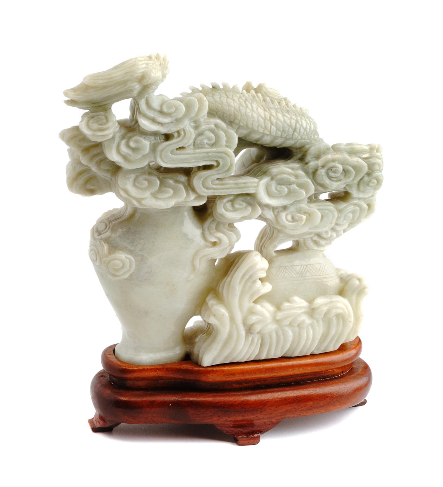 A Chinese Carved Jadeite Vase Height 7 1/2 inches.