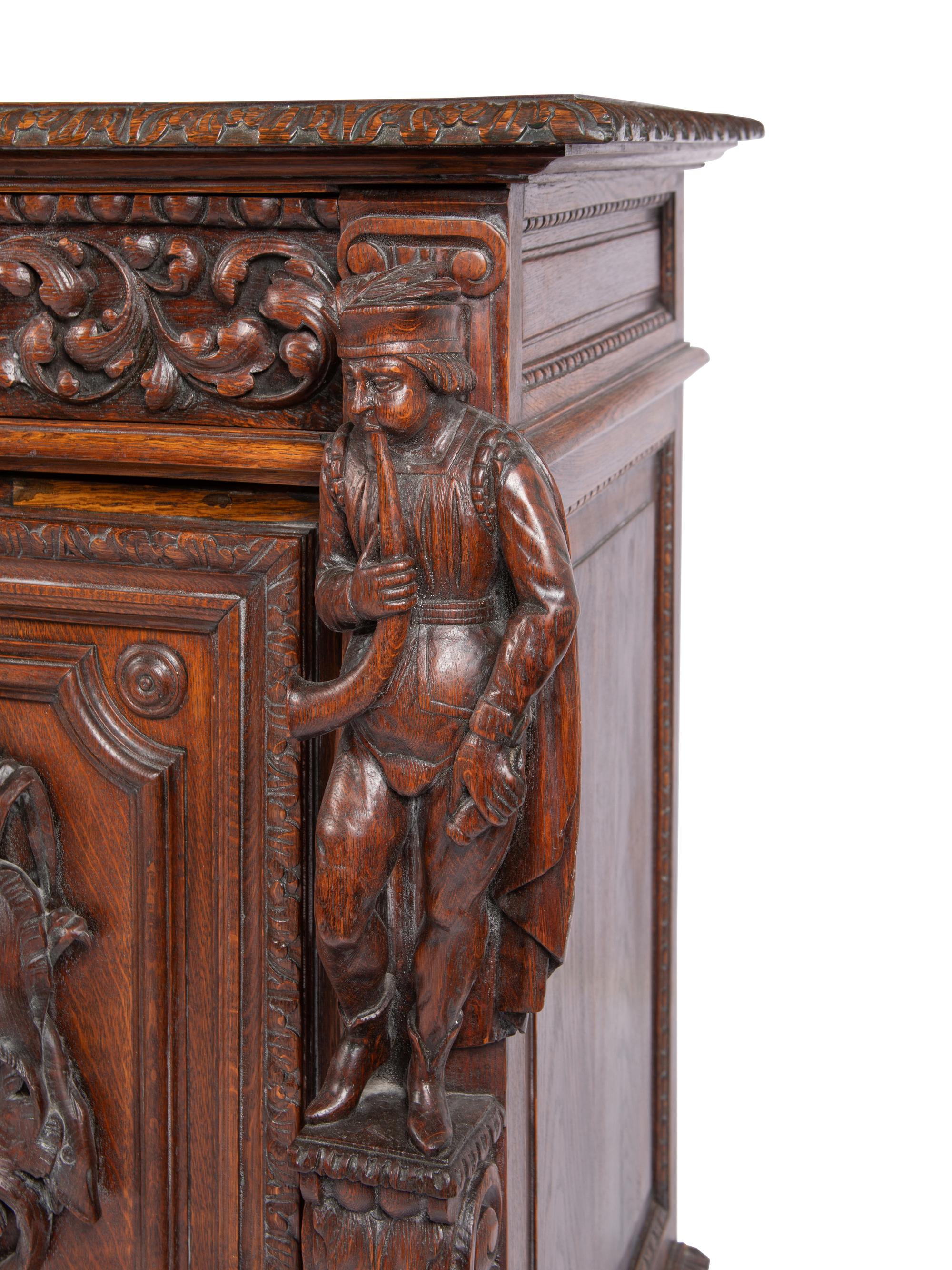 A Continental Carved Oak Cabinet