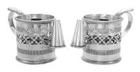 A Pair of English Silver-Plate Chambersticks, 19th Century, each formed as a mug with pierced sides.