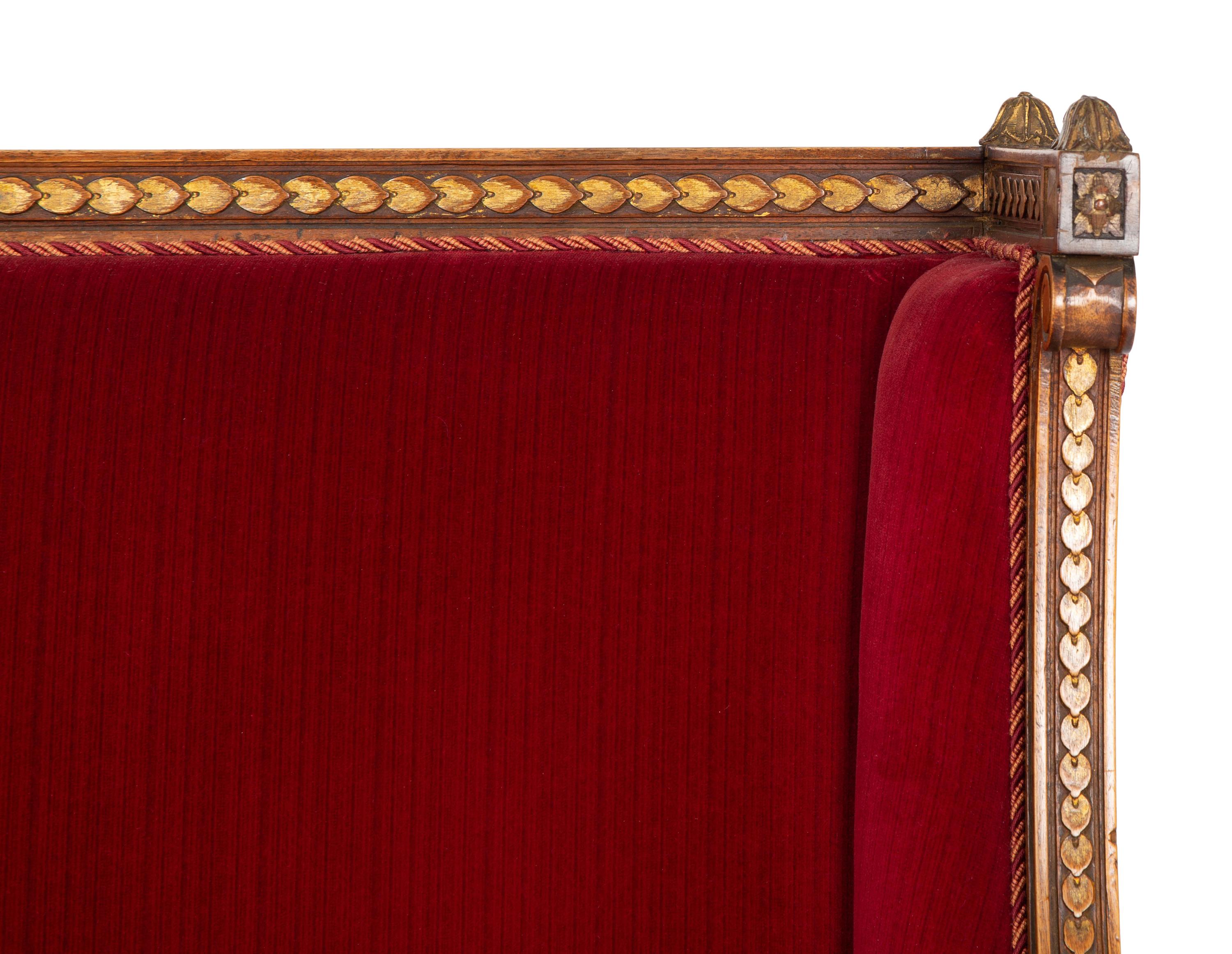 A Louis XVI Style Parcel Gilt Walnut Sofa