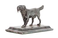 An American Water Spaniel Cast Metal Figure Height 3 x width 5 1/4 x depth 2 5/8 inches.