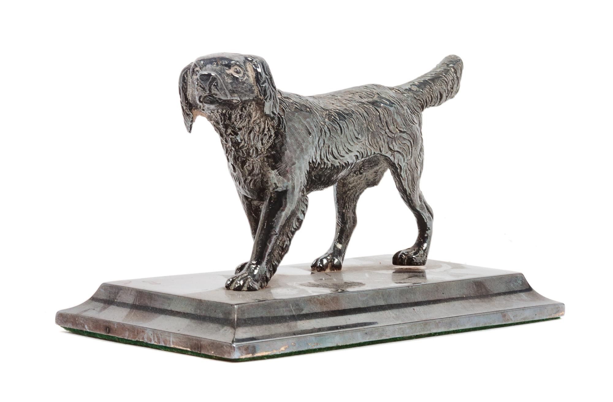 An American Water Spaniel Cast Metal Figure Height 3 x width 5 1/4 x depth 2 5/8 inches.