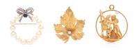 A Collection of Gold, Cultured Pearl and Diamond Brooches, 14.20 dwts.