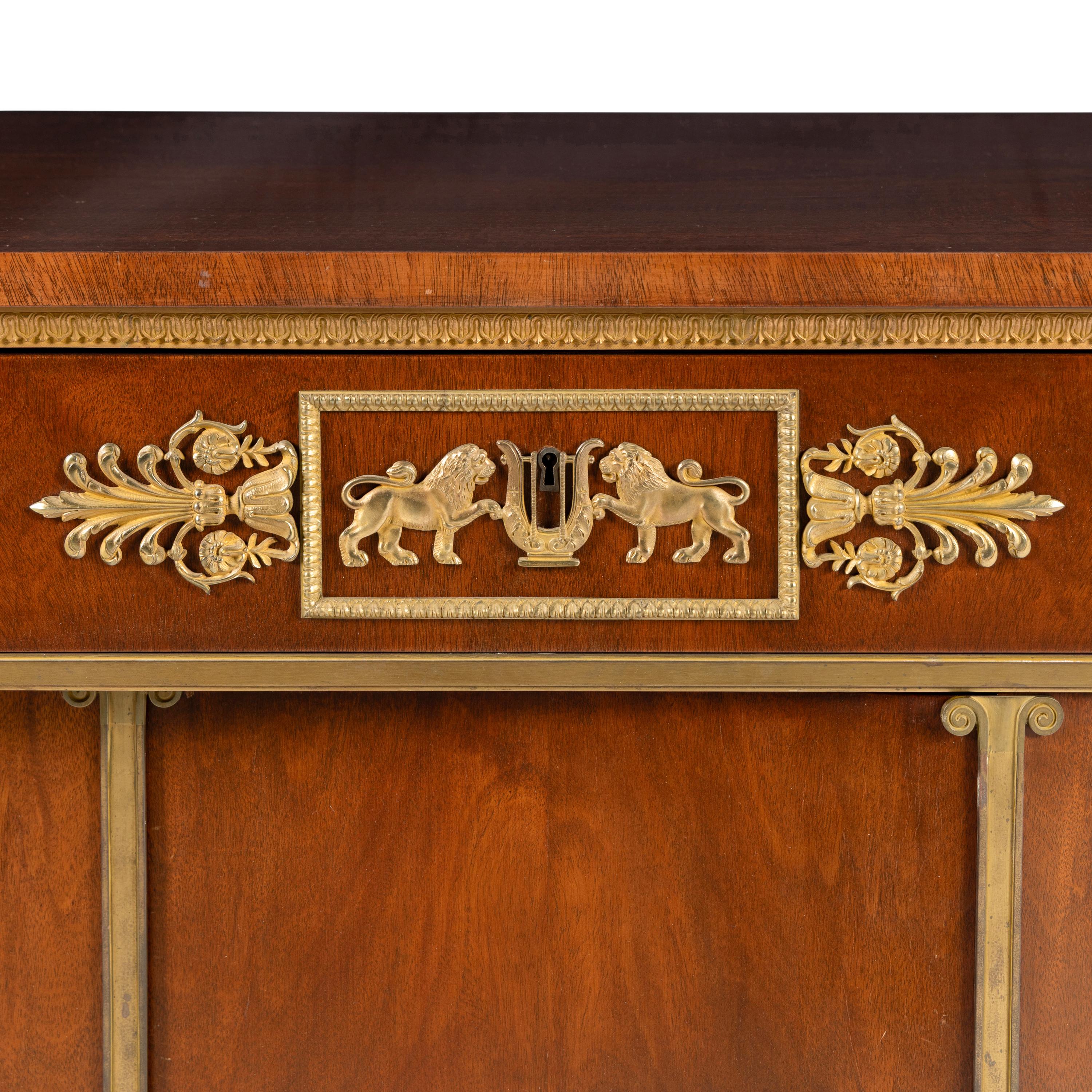 An Empire Style Gilt Bronze Mounted Mahogany Side Cabinet